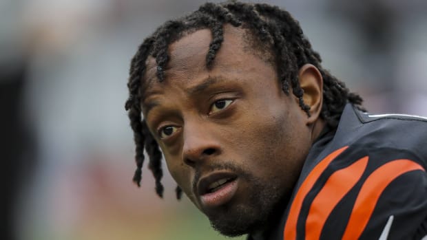 Bengals cornerback Eli Apple looks on without a helmet before a game.